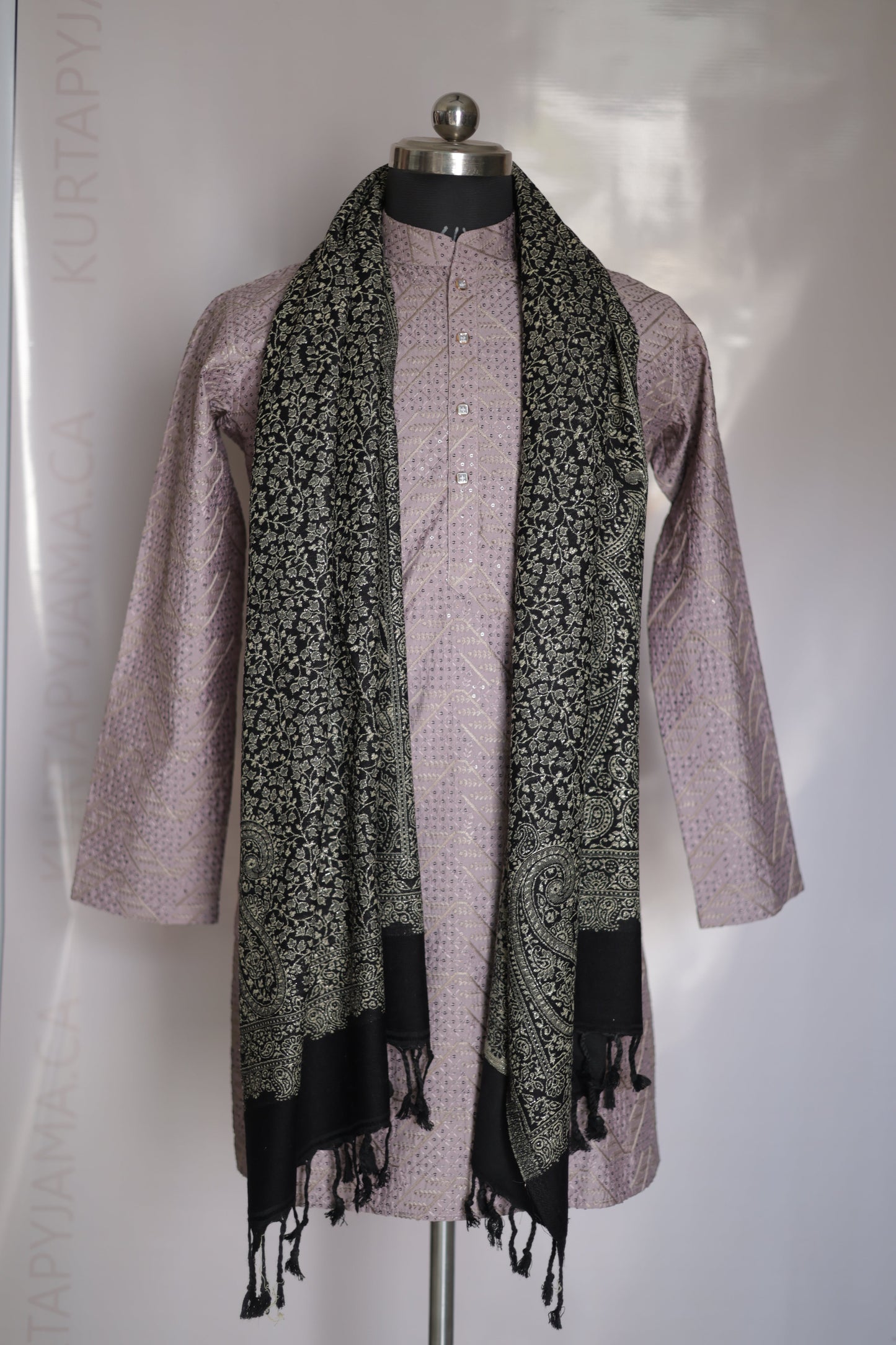 Folded scarf with black tassels on a white background