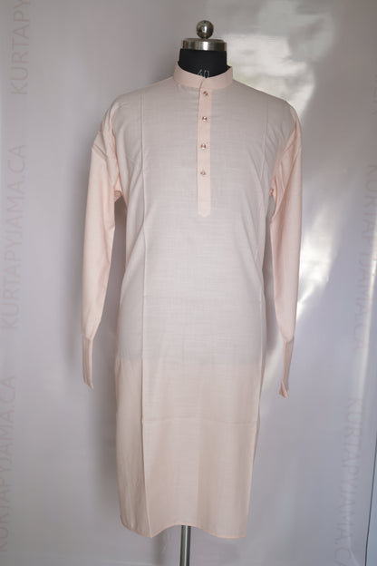 Mannequin wearing a light pink dress on a white background