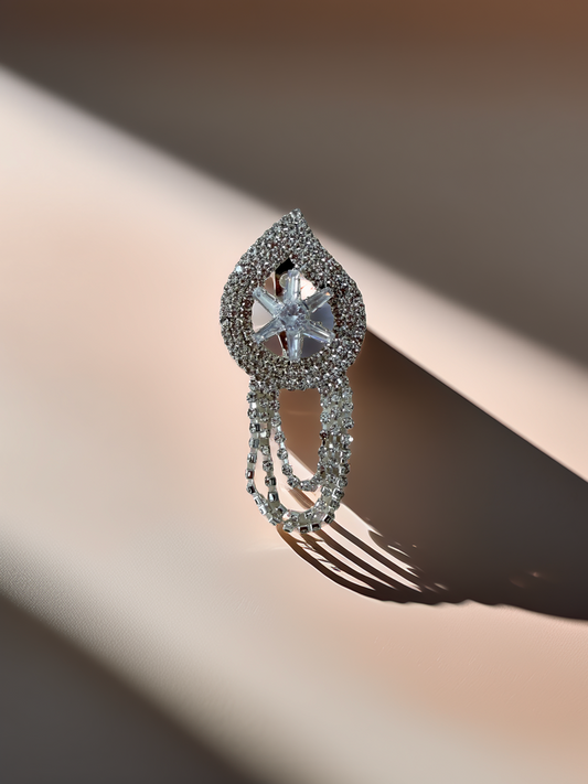 Silver ring with gemstones on a blurred background