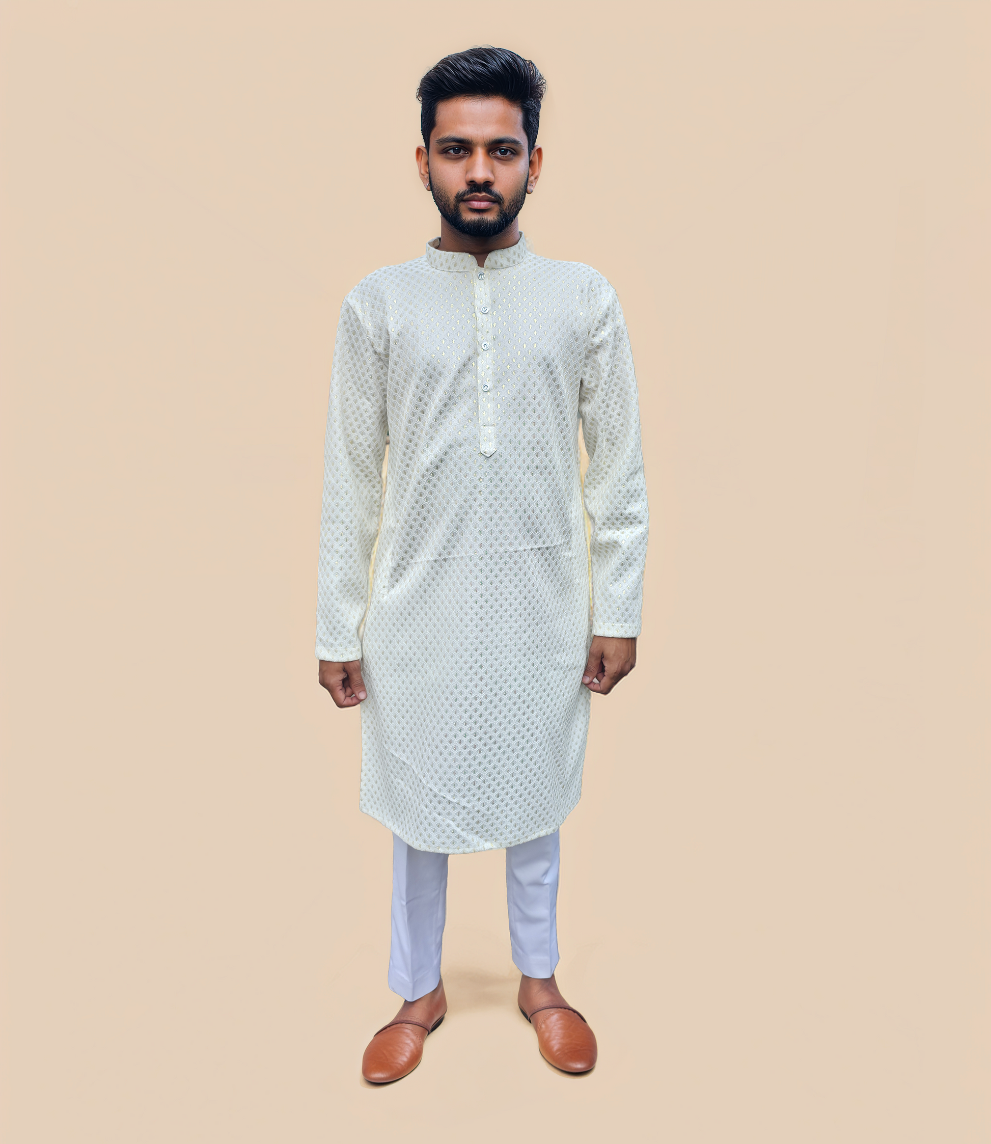 Man wearing white gold kurta pyjama 